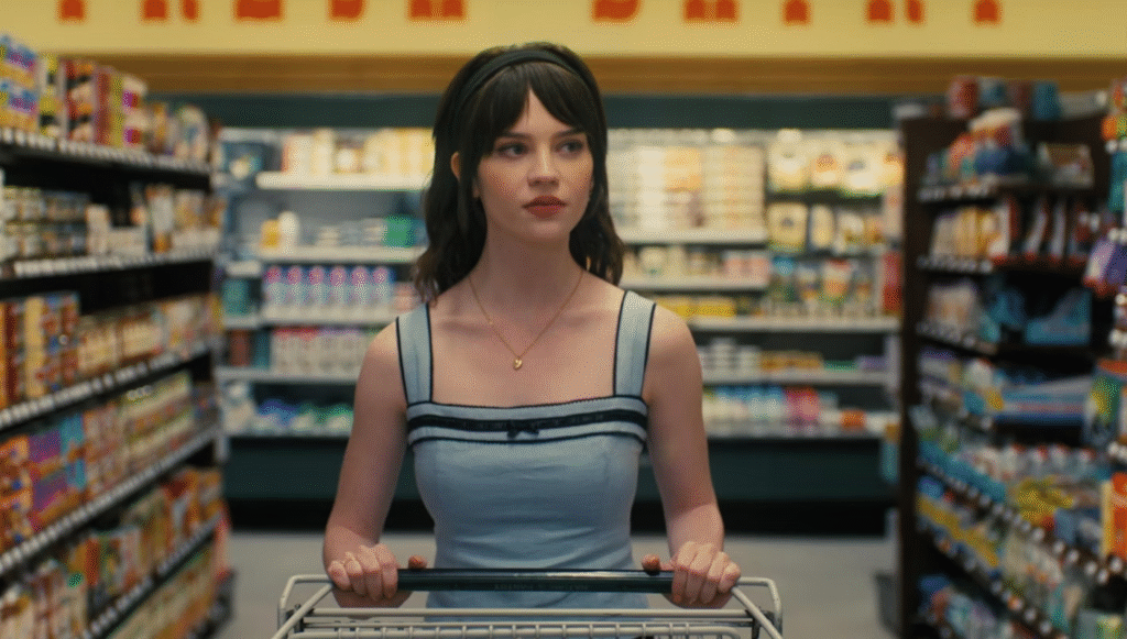 Maya in Grocery Shop a scene from companion 2025